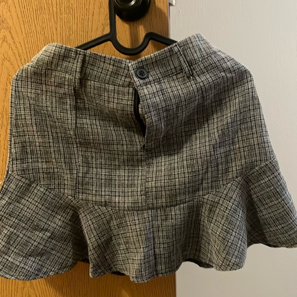 Pleated skirt with fish tail design